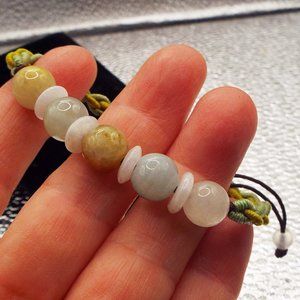 POLISHED GREY & CELADON STONE BEADS ON BRAIDED BOLO TIE BRACELET 17